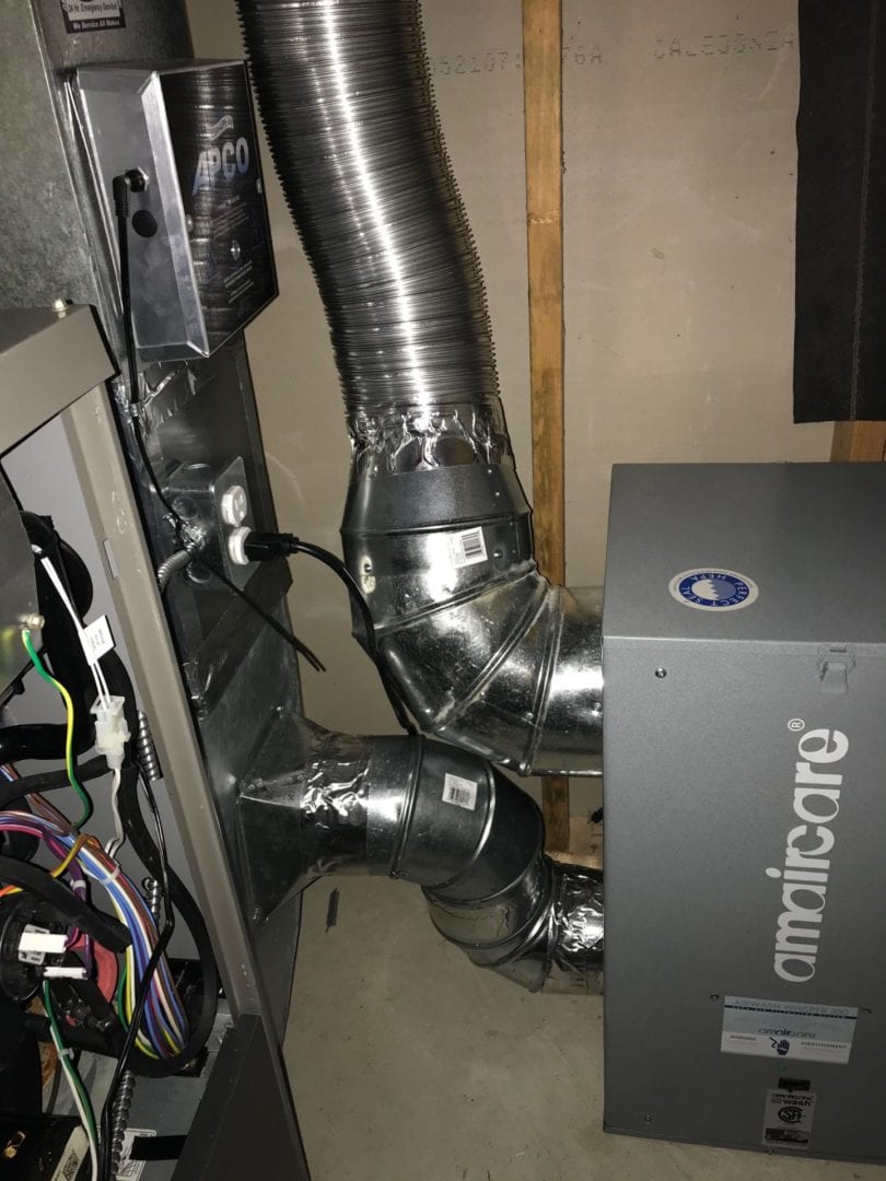 Air ducts behind furnace